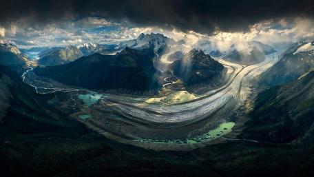 Majestic Glacier Landscape Under Dramatic Skies wallpaper
