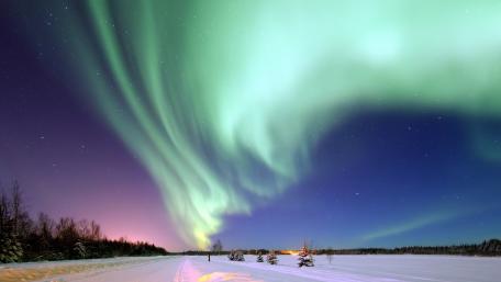 Magnificent Aurora Borealis Illuminating Winter Nights wallpaper