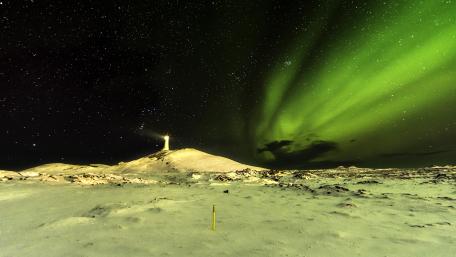 Dazzling Aurora Borealis in a Starry Night Sky wallpaper