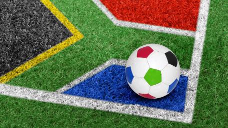 Vibrant Soccer Field Design with Colorful Ball wallpaper