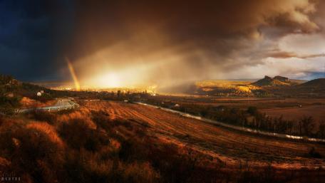 Dramatic Landscape with Rainbow and Sunset Light wallpaper