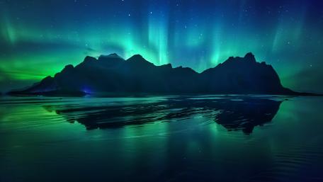 Enigmatic Aurora Illuminating the Night Sky wallpaper