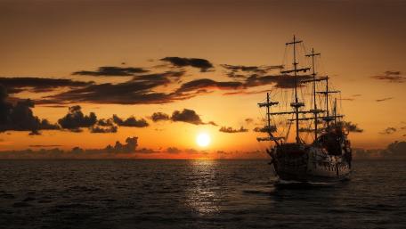 Golden Sunset with a Sailing Ship wallpaper