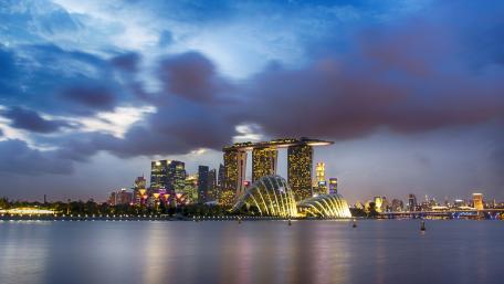 Cityscape at Dusk with Modern Architecture and Reflections wallpaper