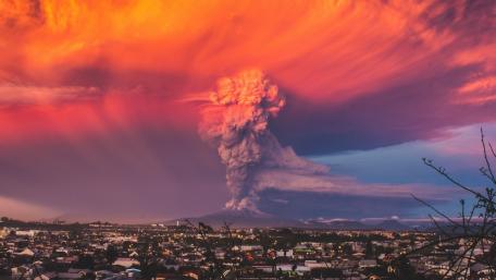 Majestic Eruption Under Colorful Skies wallpaper
