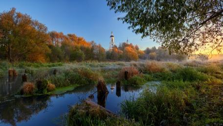 Serene Temple Amidst Autumn's Embrace wallpaper