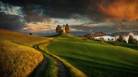 Pathway to Serenity amidst Rolling Hills wallpaper
