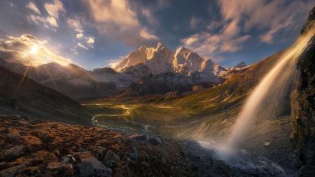 Majestic Mountain Waterfall at Sunset wallpaper