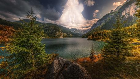 Tranquil Lake Amidst Majestic Mountains wallpaper