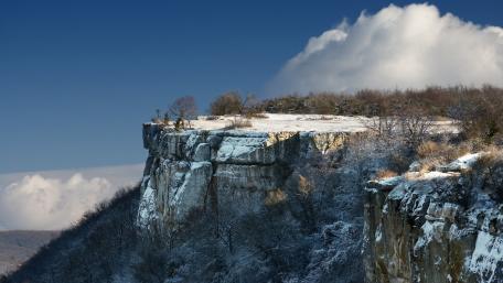 Ravine Cliff in Winter Serenity wallpaper