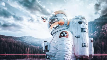 Astronaut Encounter with a Butterfly in a Futuristic Realm wallpaper