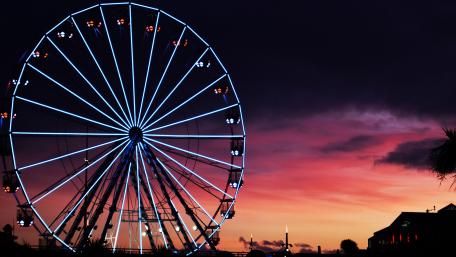 Vibrant Sunset Over Ferris Wheel Scene wallpaper