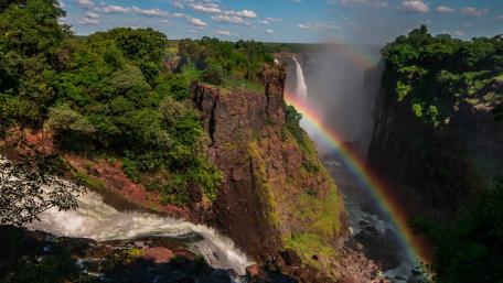 Majestic Waterfall with Vibrant Rainbow wallpaper
