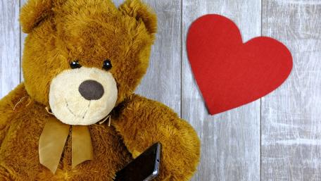 Cute Teddy Bear with a Heartfelt Touch wallpaper