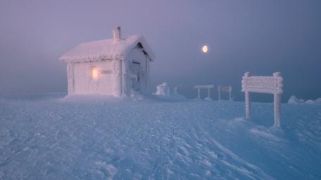 Winter Wonderland Cottage Under Moonlight wallpaper