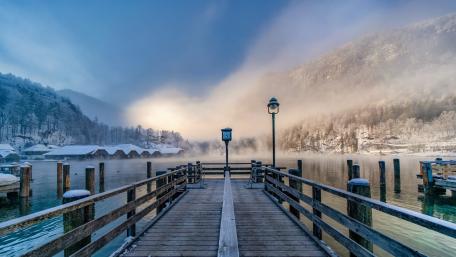 Serene Winter Pier Overlooking Tranquil Lake Shadows wallpaper