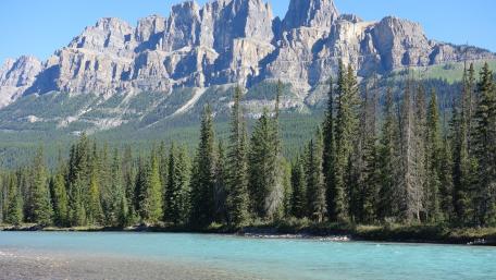 Majestic Mountains and Serene River Scene wallpaper