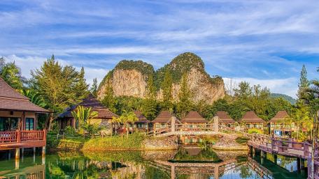 Serene Retreat Amidst Majestic Mountains wallpaper