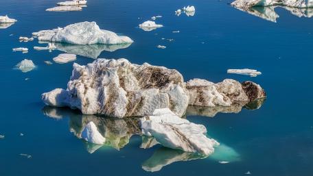 Serene Icebergs Floating on Crystal Blue Waters wallpaper