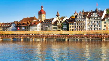 Charming Lakeside Cityscape with Historic Architecture wallpaper