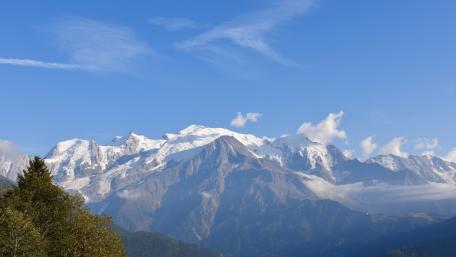 Majestic Snow-Capped Peaks Beneath a Clear Sky wallpaper
