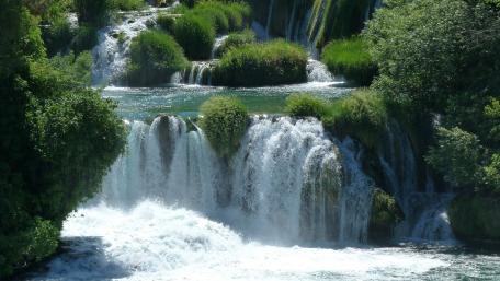 Serene Beauty of Flowing Waterfalls wallpaper