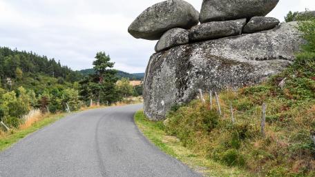 Scenic Roadside View with Rock Formation and Greenery wallpaper