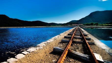 Tranquil Railway by the Lake Shore wallpaper