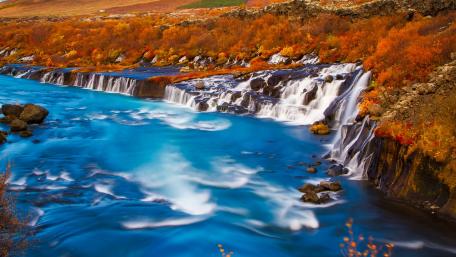 Serene Waterfalls in Vibrant Autumn Colors wallpaper