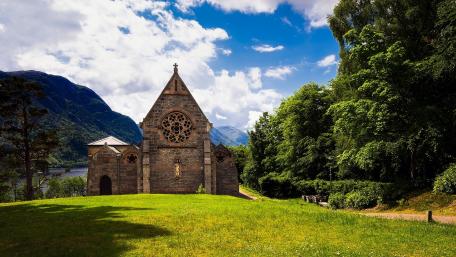 Serene Church Amidst Lush Nature wallpaper