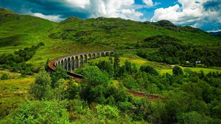 Majestic Railway Viaduct Amidst Lush Greenery wallpaper
