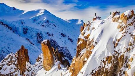 Majestic Snowy Peaks Await Adventure wallpaper