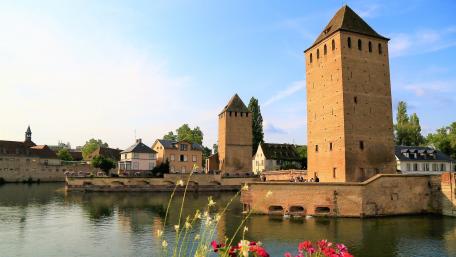 Serene Moated Castle Reflection in a Cityscape wallpaper