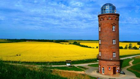 Golden Fields and a Towering Lighthouse wallpaper