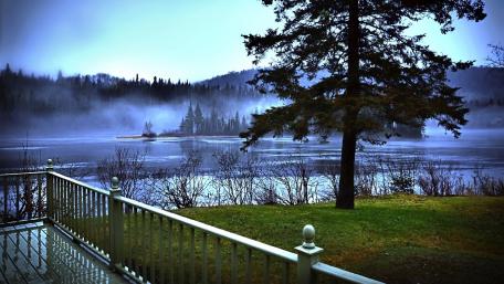 Misty Morning Serenity Over a Calm Lake wallpaper