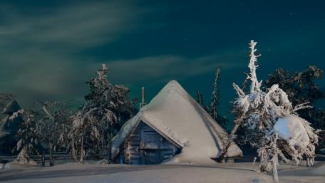 Winter Cabin Amidst a Snowy Wonderland wallpaper