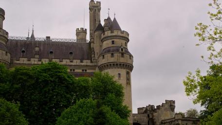 Majestic Castle Amidst Lush Greenery wallpaper