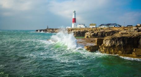 Coastal Serenity with Lighthouse Waves wallpaper