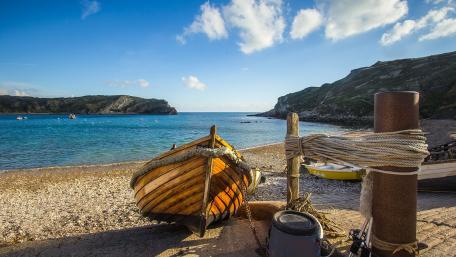 Tranquil Coastal Serenity with a Boat wallpaper