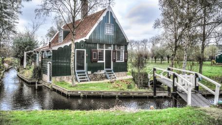 Charming Cottage by a Peaceful Canal wallpaper