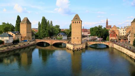 Charming Bridges of Strasbourg Amidst Scenic Waters wallpaper