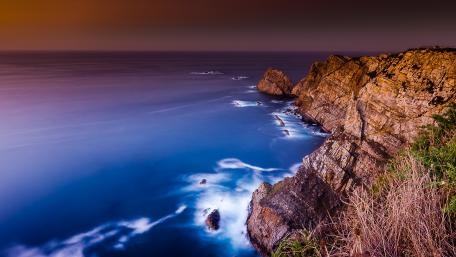 Serene Cliffs by the Sea at Dusk wallpaper