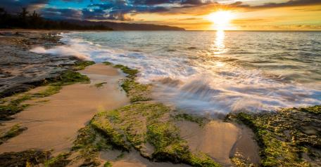 Serene Sunset Over Coastal Waterscape wallpaper