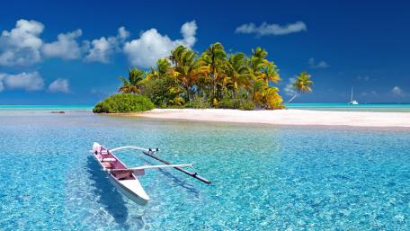 Tropical Paradise on a Clear Blue Sea wallpaper