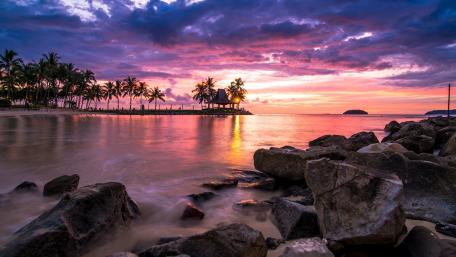 Tranquil Tropical Sunset Over Serene Bay wallpaper