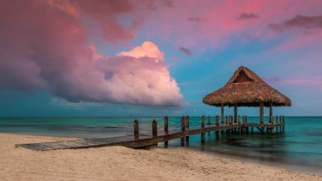 Tropical Pier Under Pink Skies at Dusk wallpaper