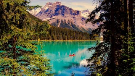 Mountain Lake Serenity with Boat wallpaper