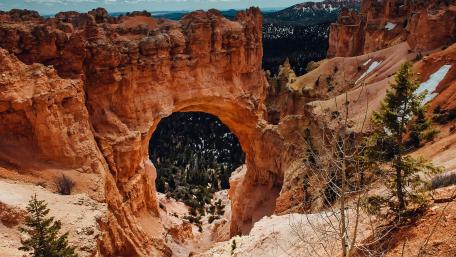 Majestic Natural Arch in Rugged Landscape wallpaper