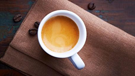 Brewed espresso and coffee beans wallpaper