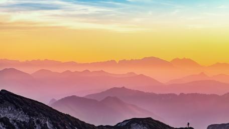 Majestic Sunset Over Serene Mountain Ranges wallpaper